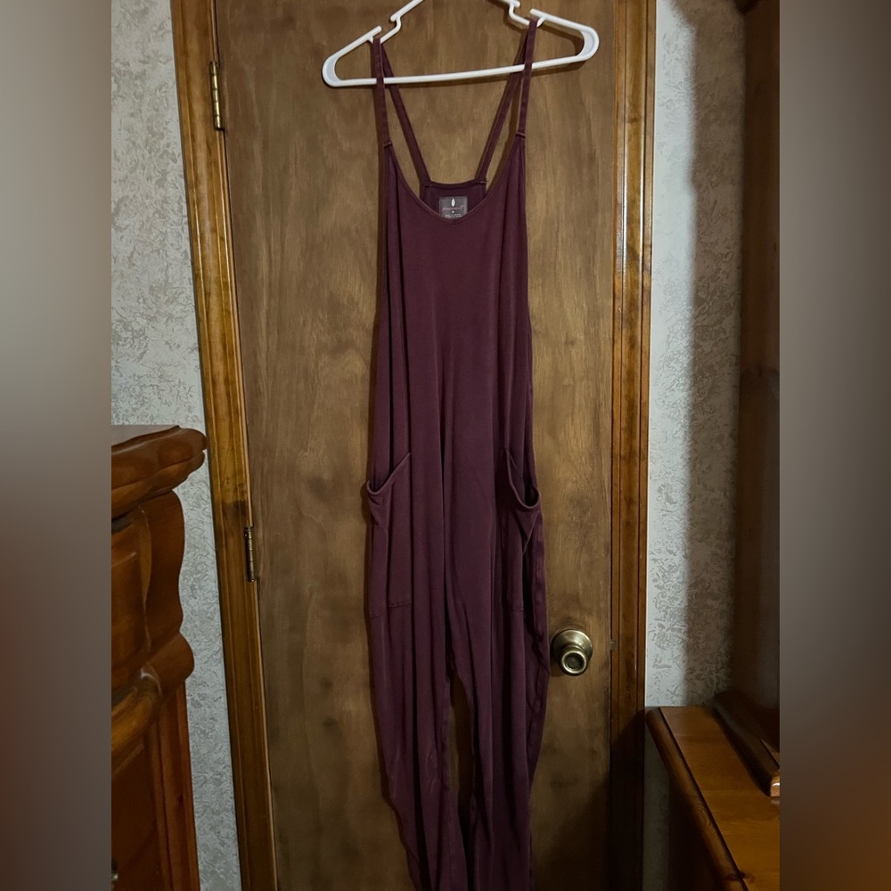 Free People Hot Shot Onesie
Size Medium 
Color Burgundy